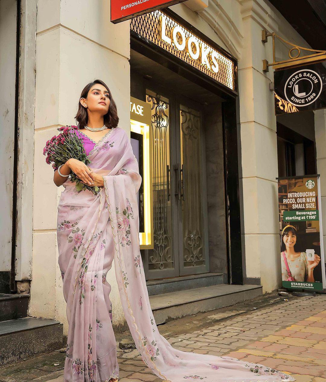Product Image - Designer Satin Organza Saree with Handcrafted Floral Prints and Pearl Cutwork Border