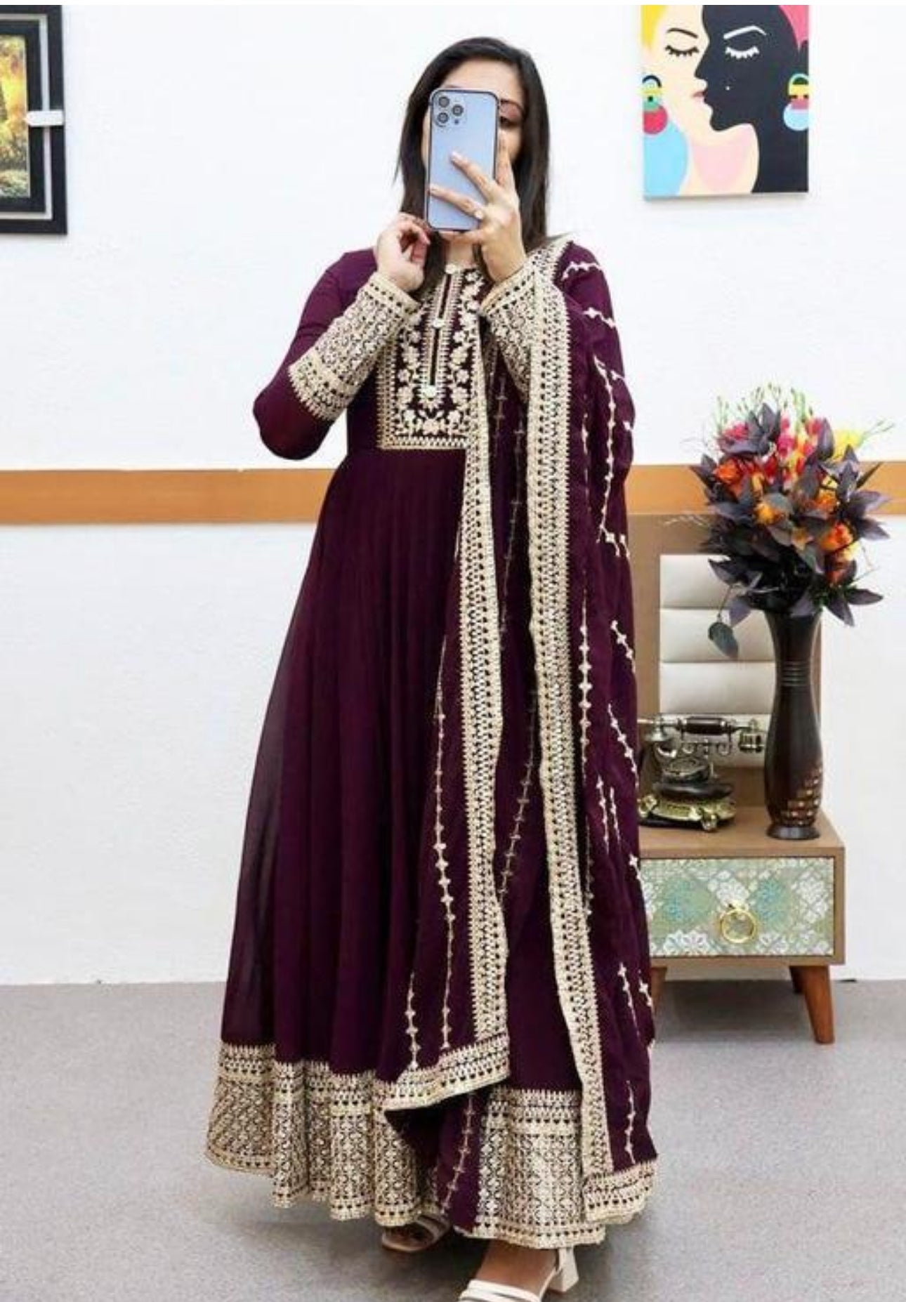 Elegant blue and gold Anarkali gown with intricate embroidery