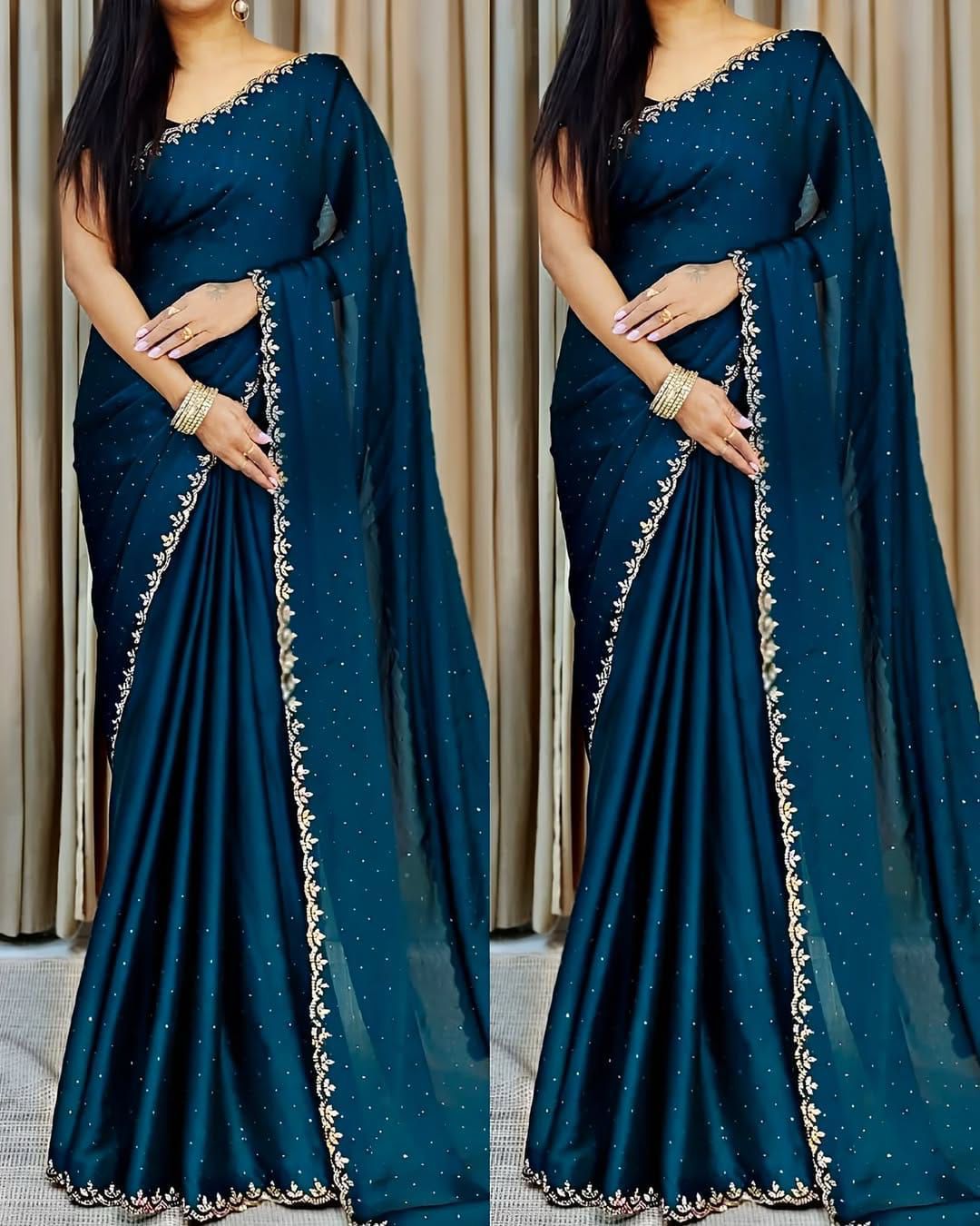 A beautiful red and gold designer saree with intricate embroidery and embellishments.