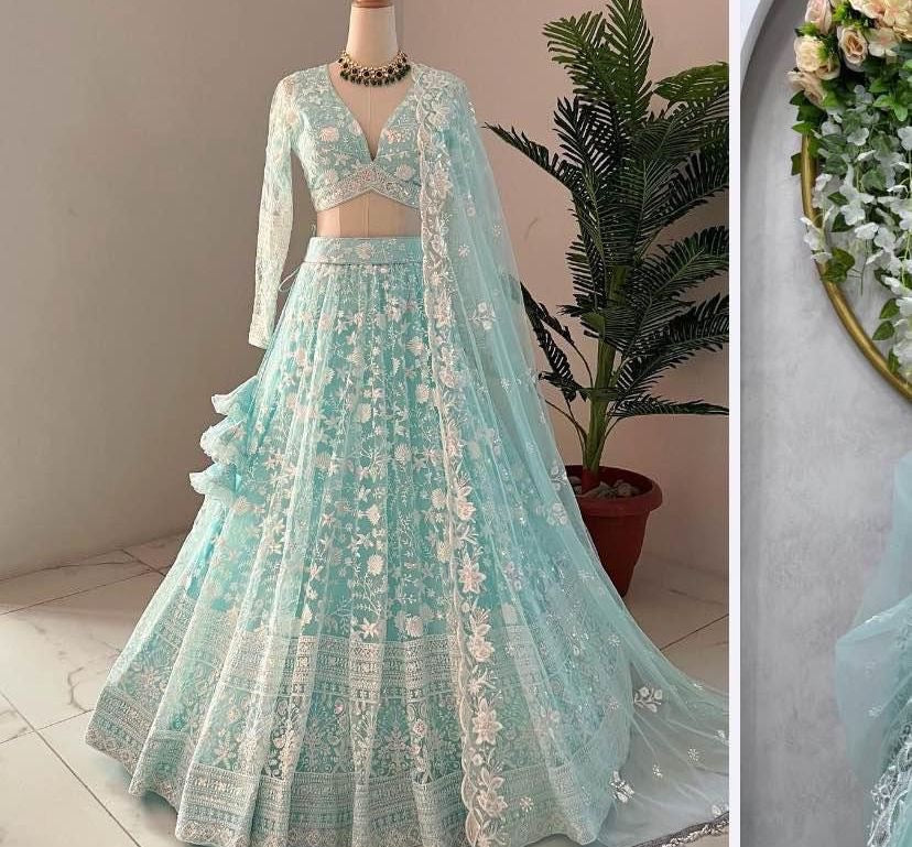Beautiful lehenga displayed on a mannequin, adorned with intricate embellishments and ruffles, showcasing exquisite haute couture fashion design.