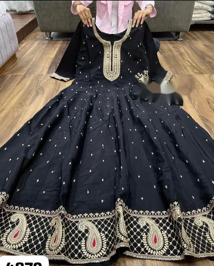 Designer black Anarkali suit with intricate patterns and stylish flare
