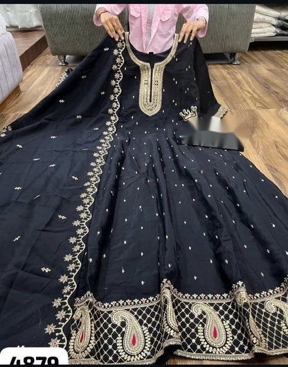 Elegant black and gold Anarkali suit with intricate detailing and high neckline