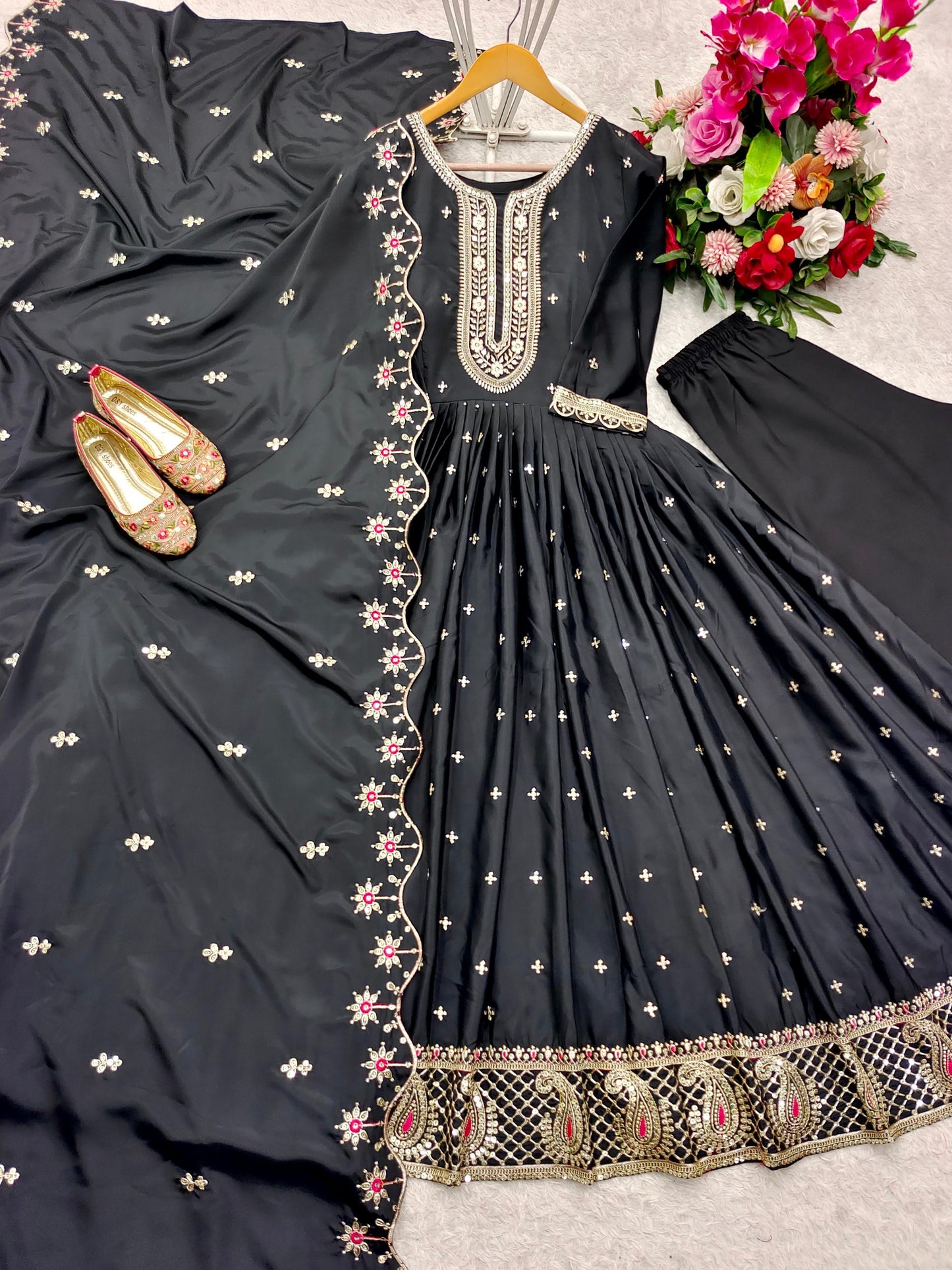 Stunning black Anarkali suit with intricate embroidery, perfect for parties and weddings