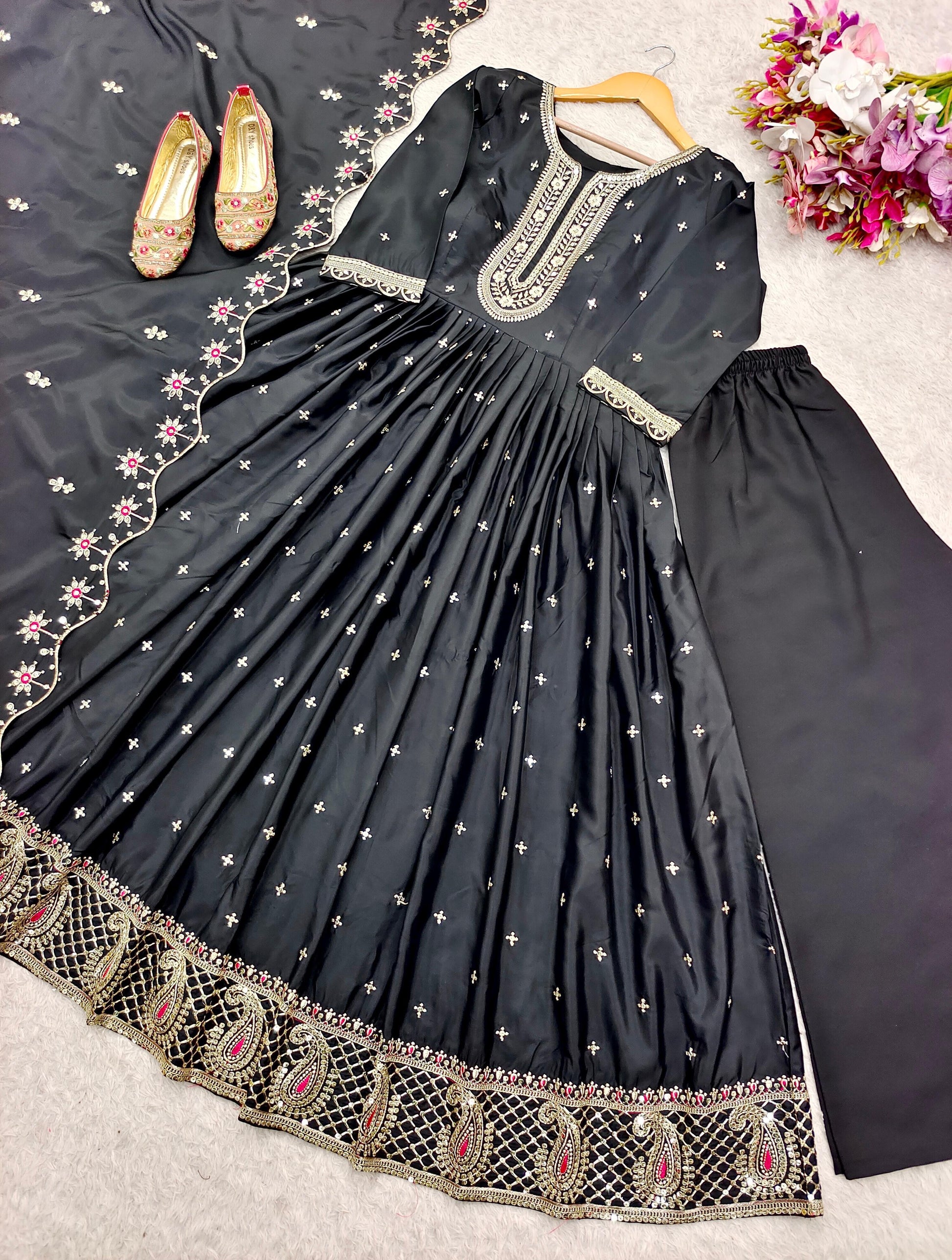 Black Anarkali suit with heavy embroidery and sheer dupatta, perfect for weddings