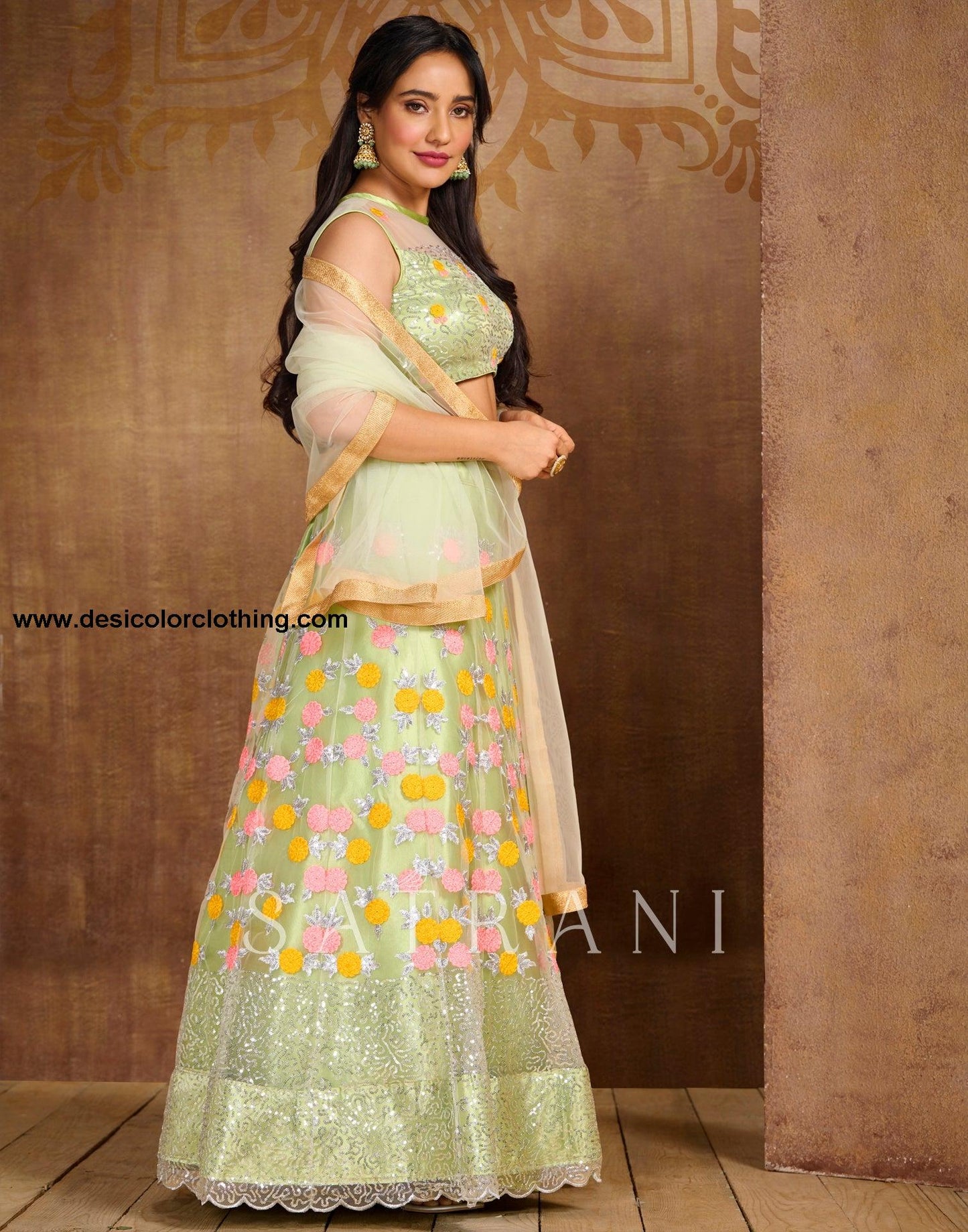 Pista Cream Coloured Net Sequence Embroidered Partywear Lehenga  | SLV125L10496