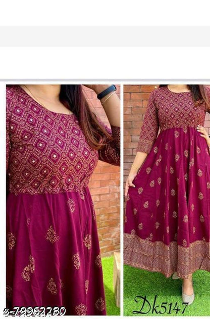 A beautiful red and gold designer Anarkali top with intricate embroidery and a flared silhouette.